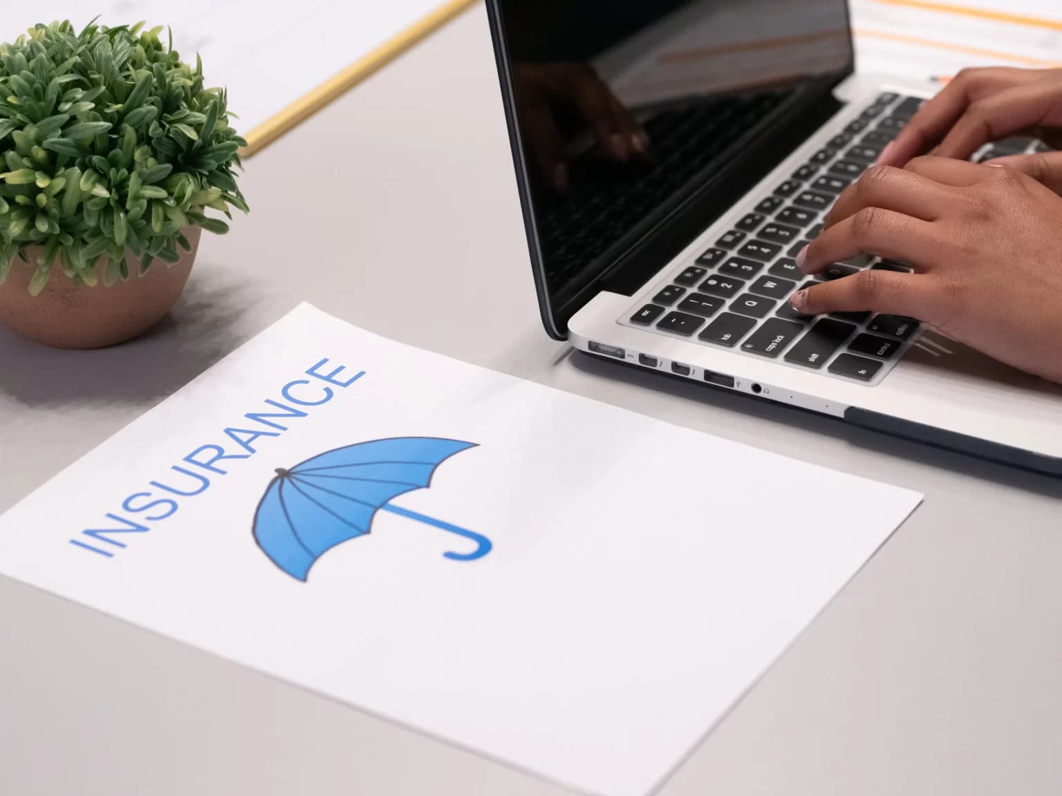 Insurance professional reviewing a claim with a client